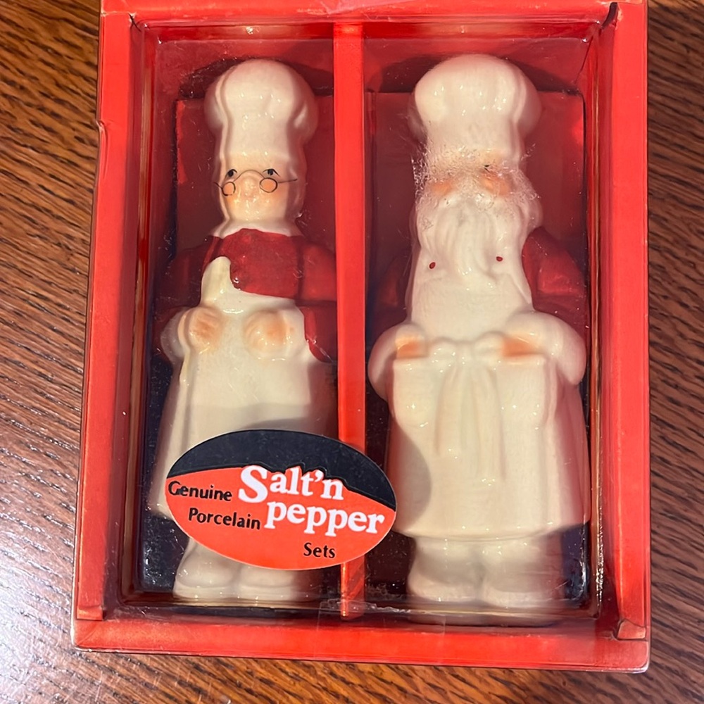 Porcelain vintage Santa set salt and pepper shakers.  Never used.